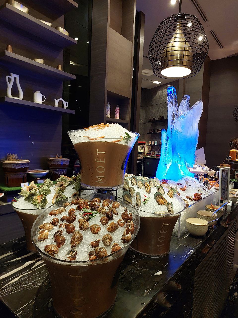 Premium seafood and champagne display at a hotel buffet
