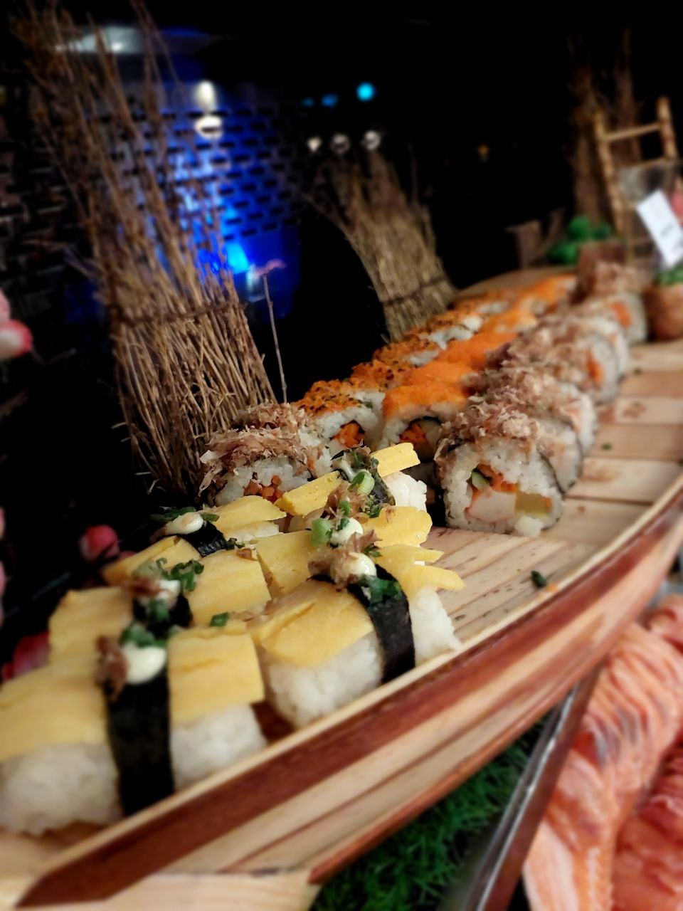 Freshly prepared sushi platter at a hotel buffet spread