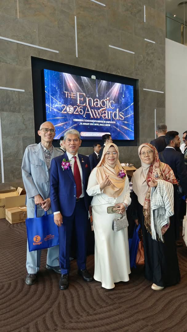 Team photo in front of The Enagic 2026 Awards stage screen